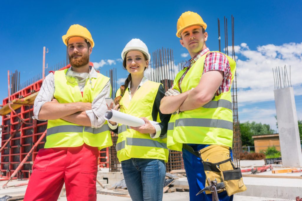 Three construction workers on mission