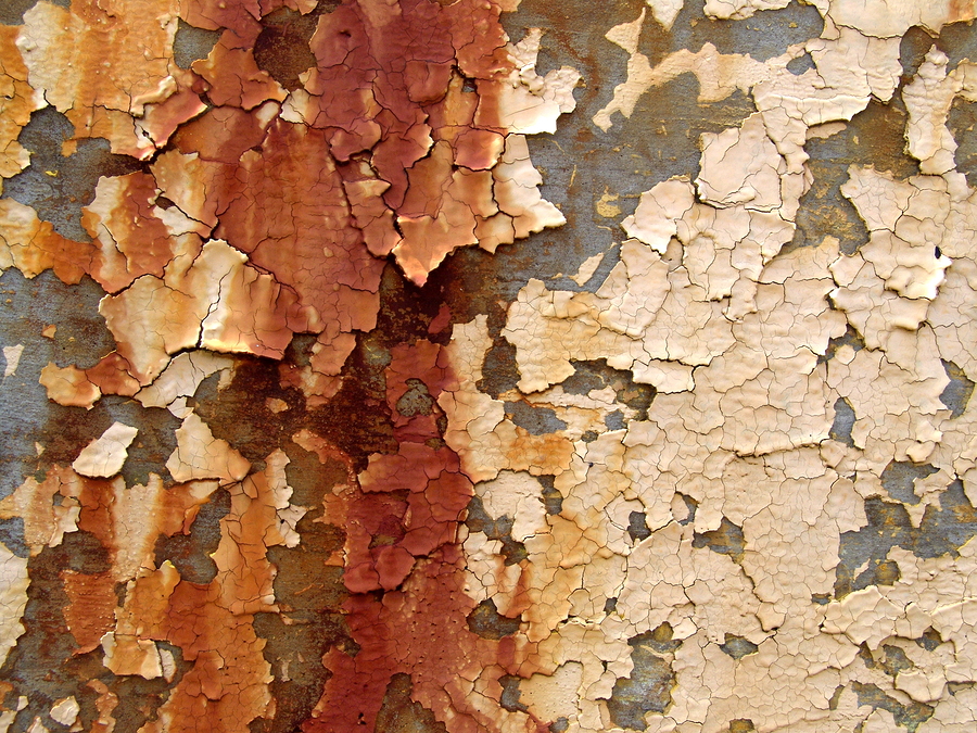 Flaking paint with rusting wall