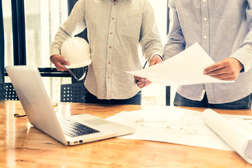 Contractors discussing in office